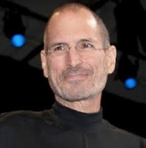 A person smiling for the camera Description automatically generated
